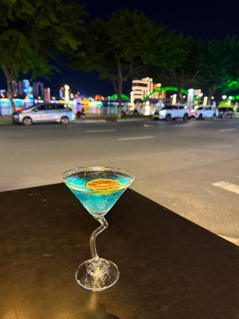 Blue cocktail with orange slice at Bamboo 2 Bar
