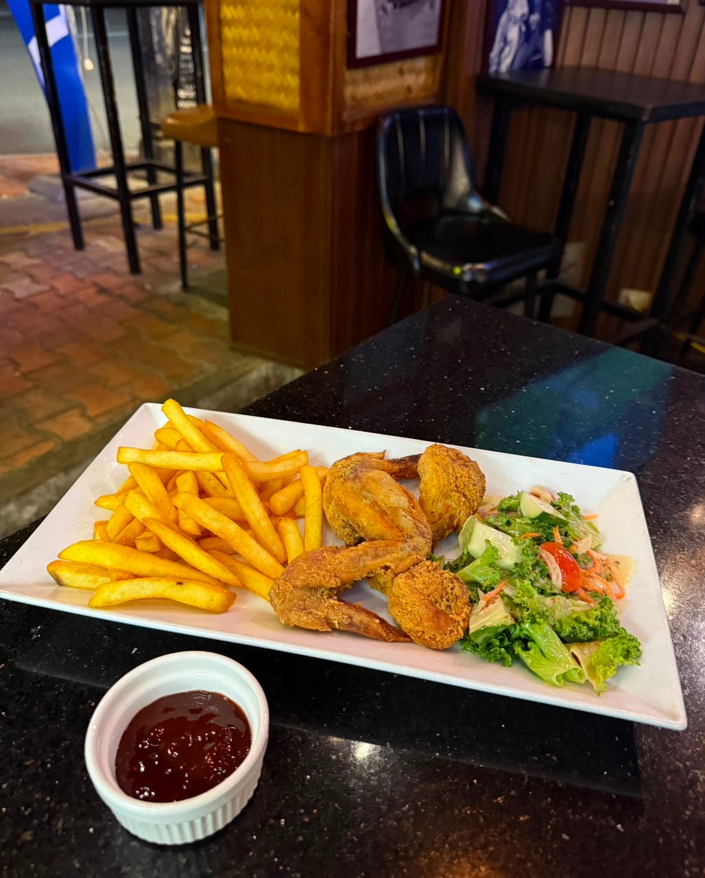 Fried chicken, fries and salad at Bamboo 2 Bar